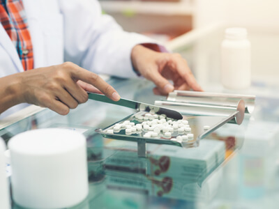 Medicine Tablets On Counting Tray With Counting Spatula At Pharm